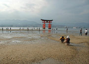 Itsukushima torii sand.jpg